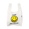 White Baggu tote bag with smiley face, 'Have a nice day', and small logo detail