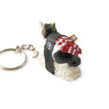 Sushi Cat Keychain Blind Box - Vol.2 by Mofusand features a cute cat figurine in a life jacket on a white platform with a black strap, ideal for fans of quirky collectibles!.