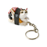 The Mofusand Sushi Cat Keychain Blind Box - Vol.2 includes a cat figurine wrapped in a sushi roll with wooden plate and seaweed details, perfect for Collectible Sushi Cats fans and as an adorable collection addition.