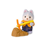 Gray cat baby figurine holding a yellow bar with blue overalls