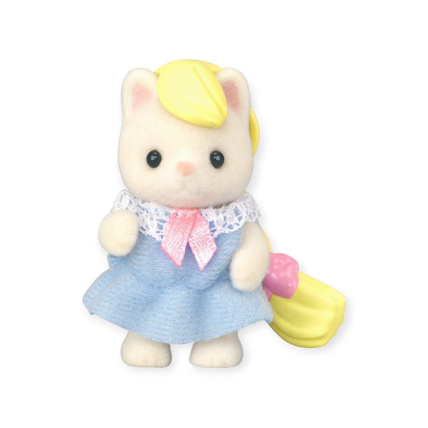 A Sylvanian Families Blind Bag - Baby Fun Hair cat figurine with cream fur, yellow ponytail accessory, blue dress, white lace collar, and pink bow stands against a white background.
