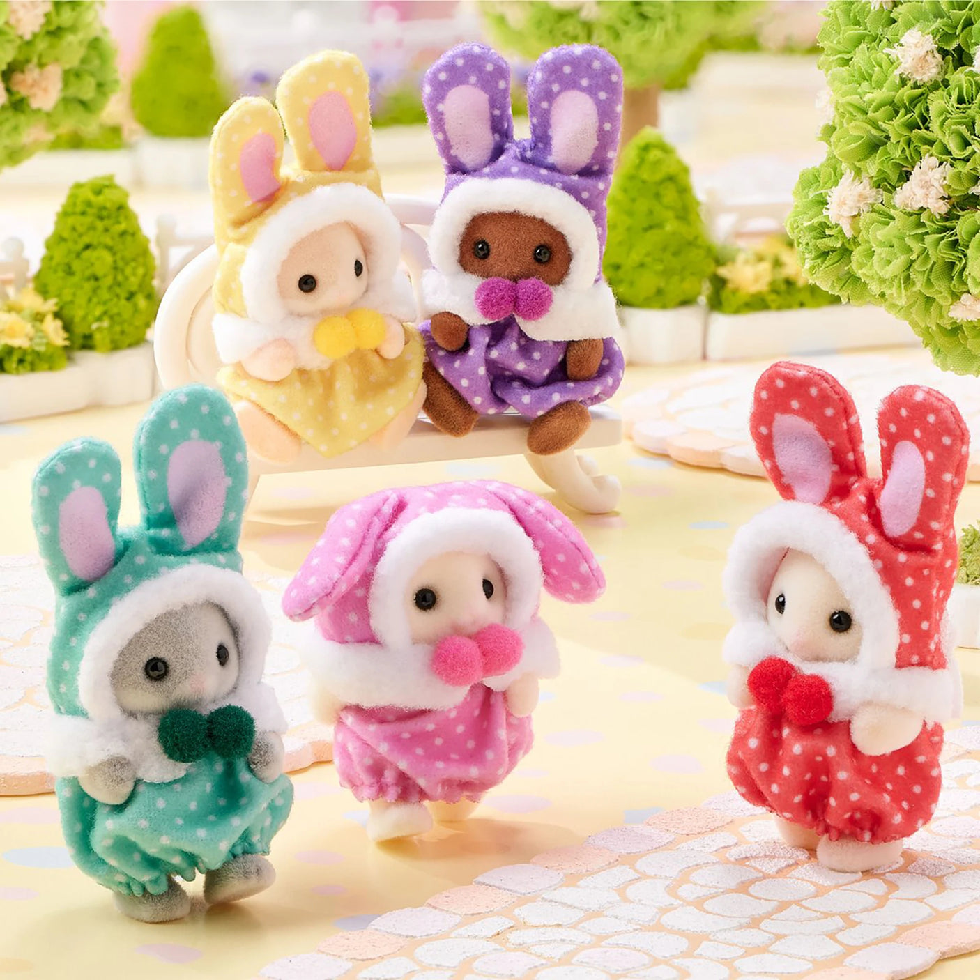 Assorted baby bunny plush costume figures with different colored outfits