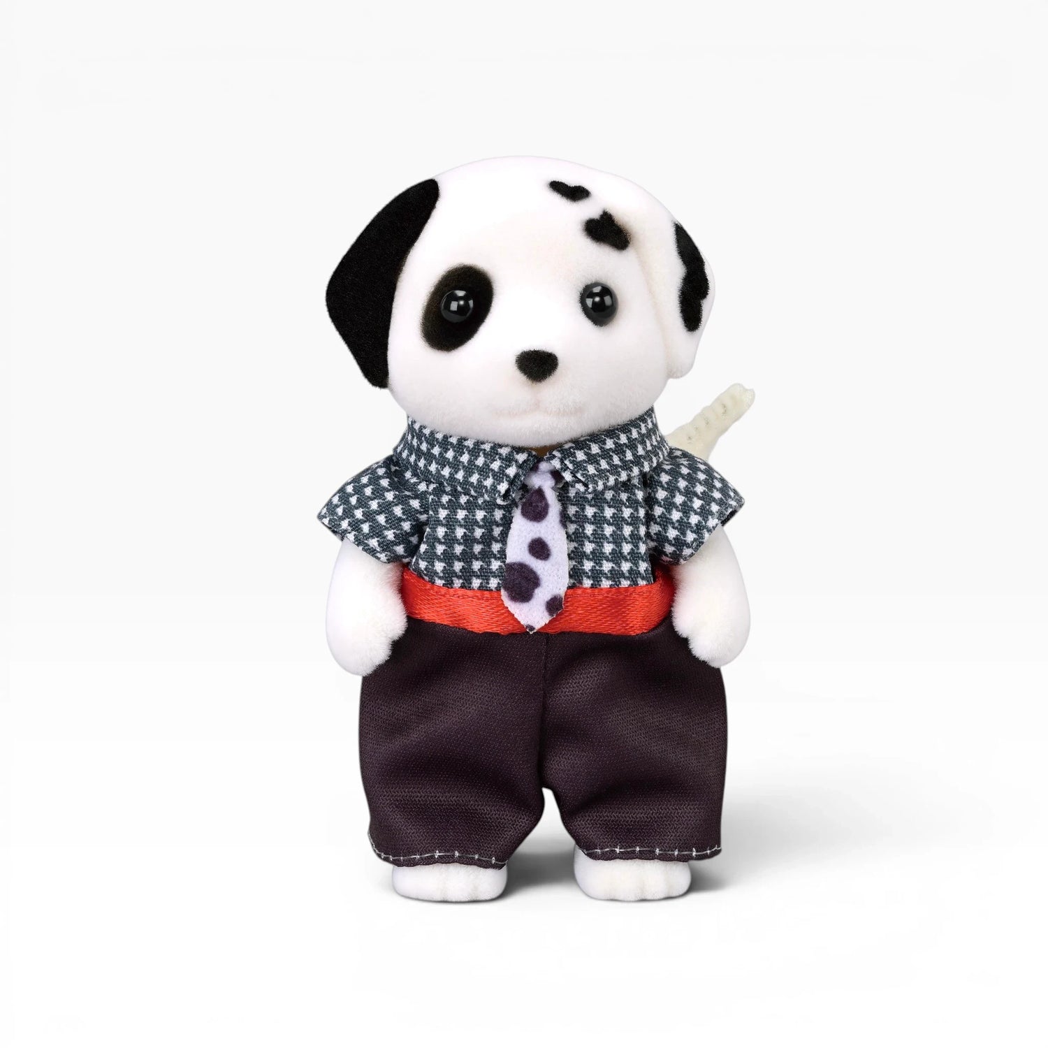 Plush dalmatian doll with black-and-white spots, houndstooth shirt, red waist detail