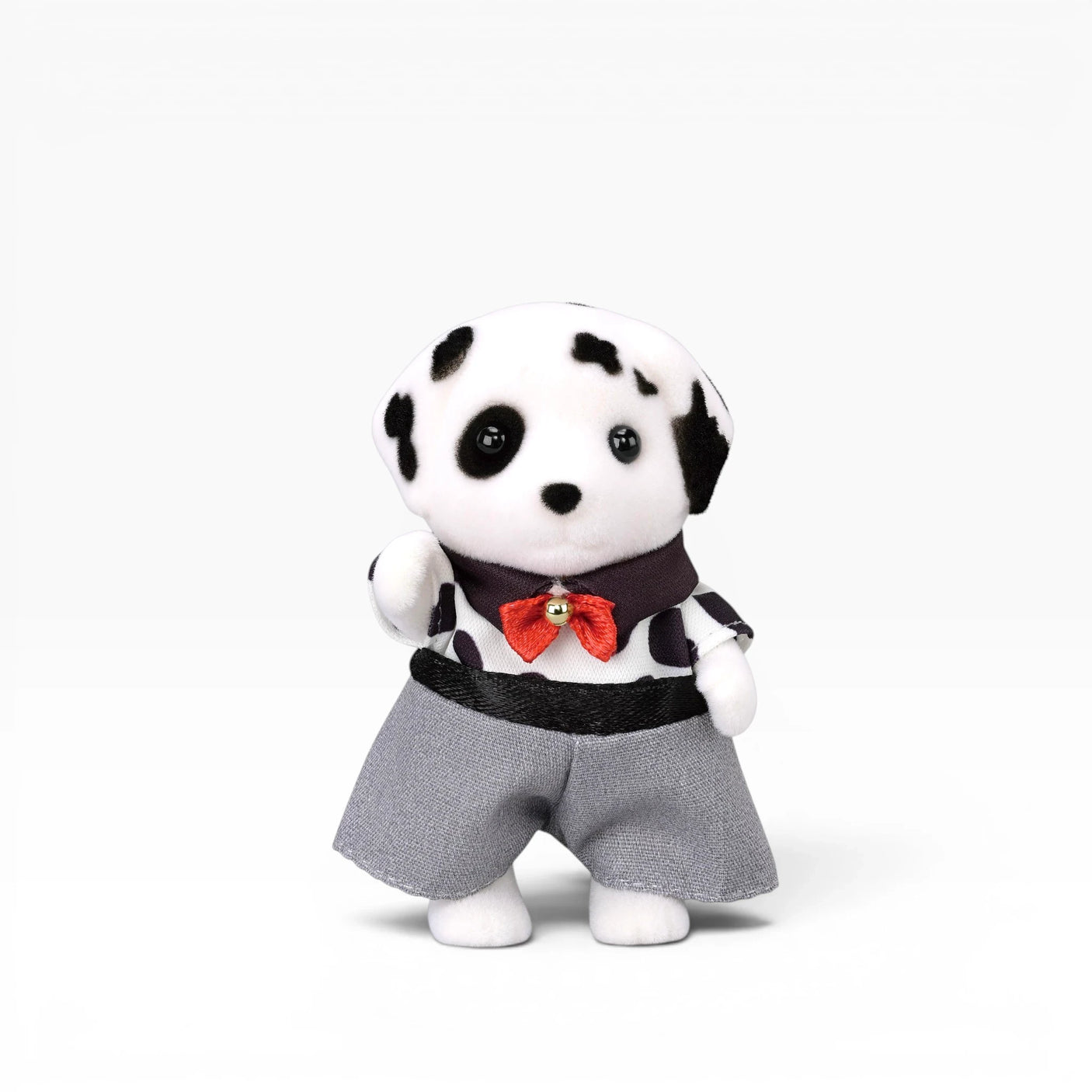 Plush dalmatian doll in gray pants and black outfit with red bow tie