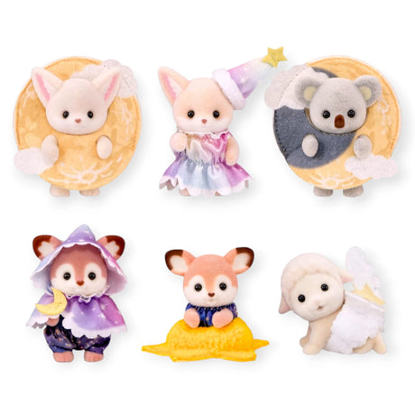 Four animal figurines in moon-shaped accessories, including white cat and koala