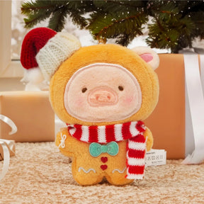 The LuLu the Piggy - Gingerbread Man Keychain features LuLu dressed in a gingerbread outfit with a Santa hat and striped scarf, perfect as a festive ornament or accessory for the holiday season.