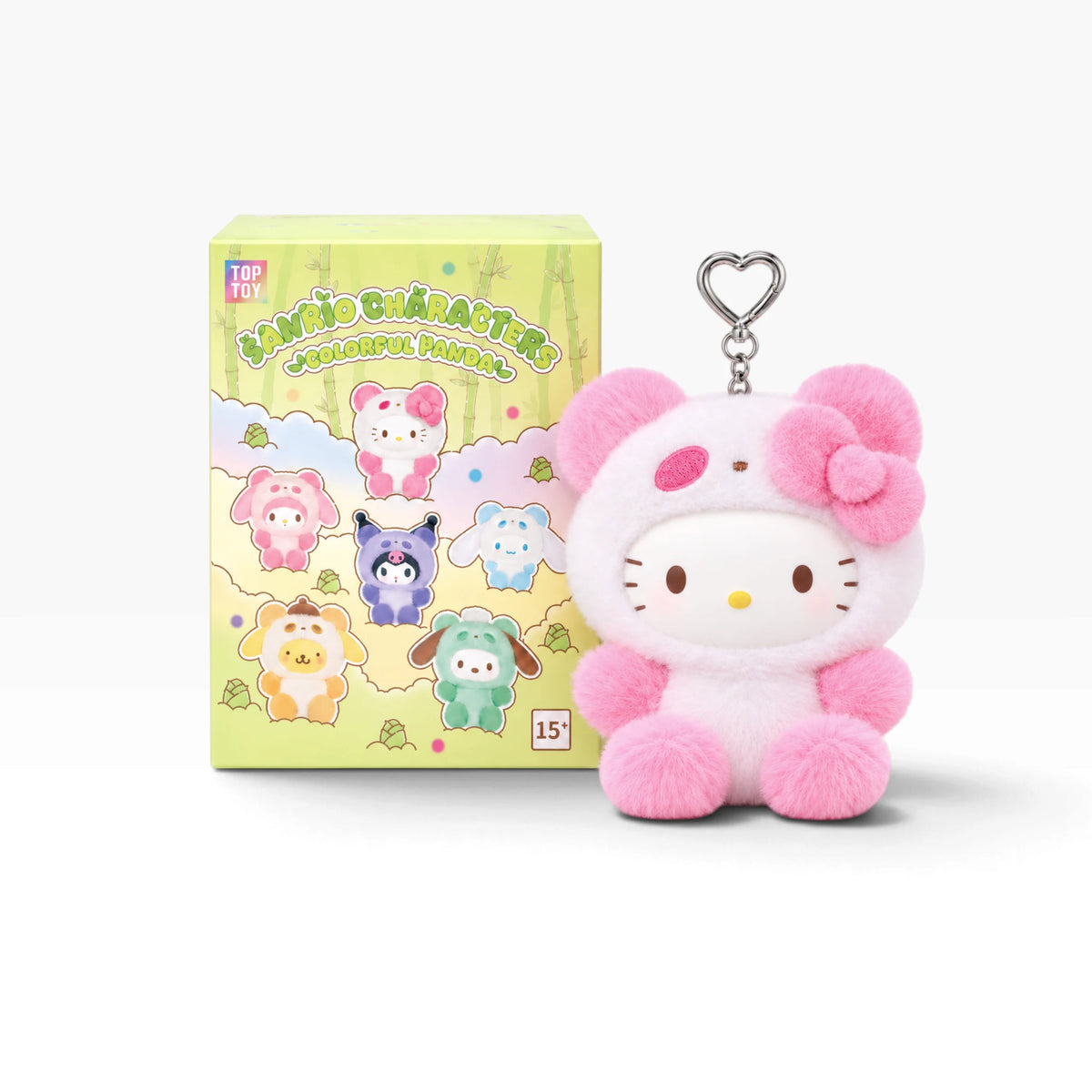 Pink character plush pendant with heart keychain ring, standing with soft fabric.