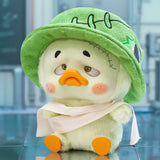 Upset Duck Blind Box - Colourful Player Plush Keychain showing a duck in a green stitched hat with sad eyes and orange beak by Upset Duck