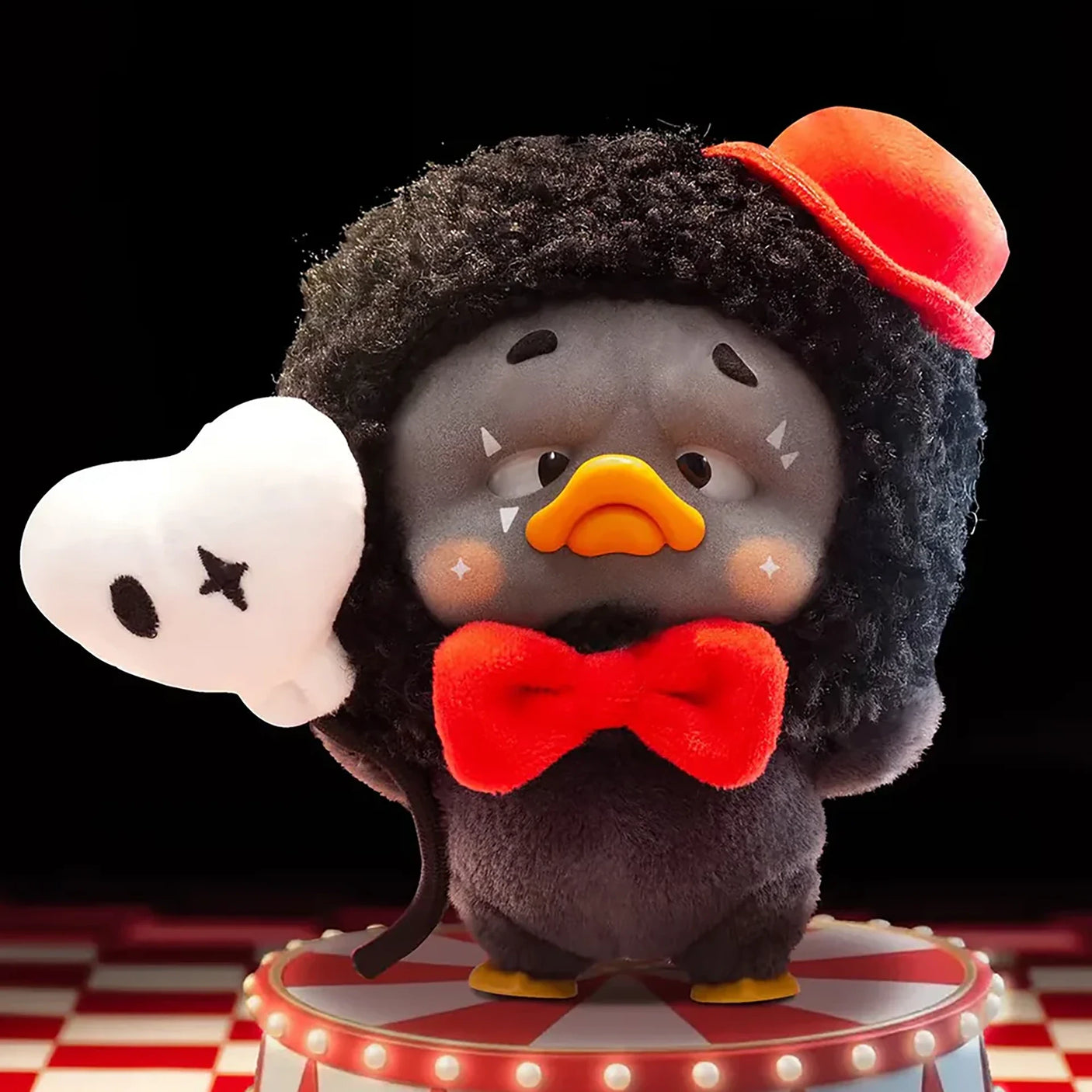 Upset Duck Blind Box - Colourful Player Plush Keychain showing a black duck with curly hair, red bow tie, and mini top hat by Upset Duck