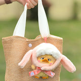 Small bunny-hood plush duck in a beige woven tote bag