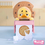 Upset Duck Blind Box - Status Display showing a sad yellow duck with a bitten cookie hat at a pink desk by Upset Duck