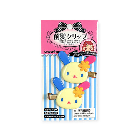 Bunny hair clip card with two pastel clips and a black polka-dot bow