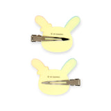 Two pastel bunny hair clips with metal snap bars, light yellow with blue ears
