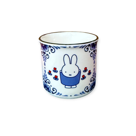Side angle of Miffy Ceramic Mug showcasing vintage blue floral design and classic Nijntje character, gallery image 1