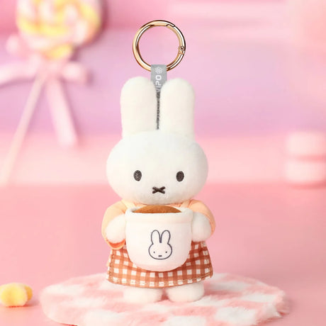 Rabbit plush keychain with tan apron and bunny face detail