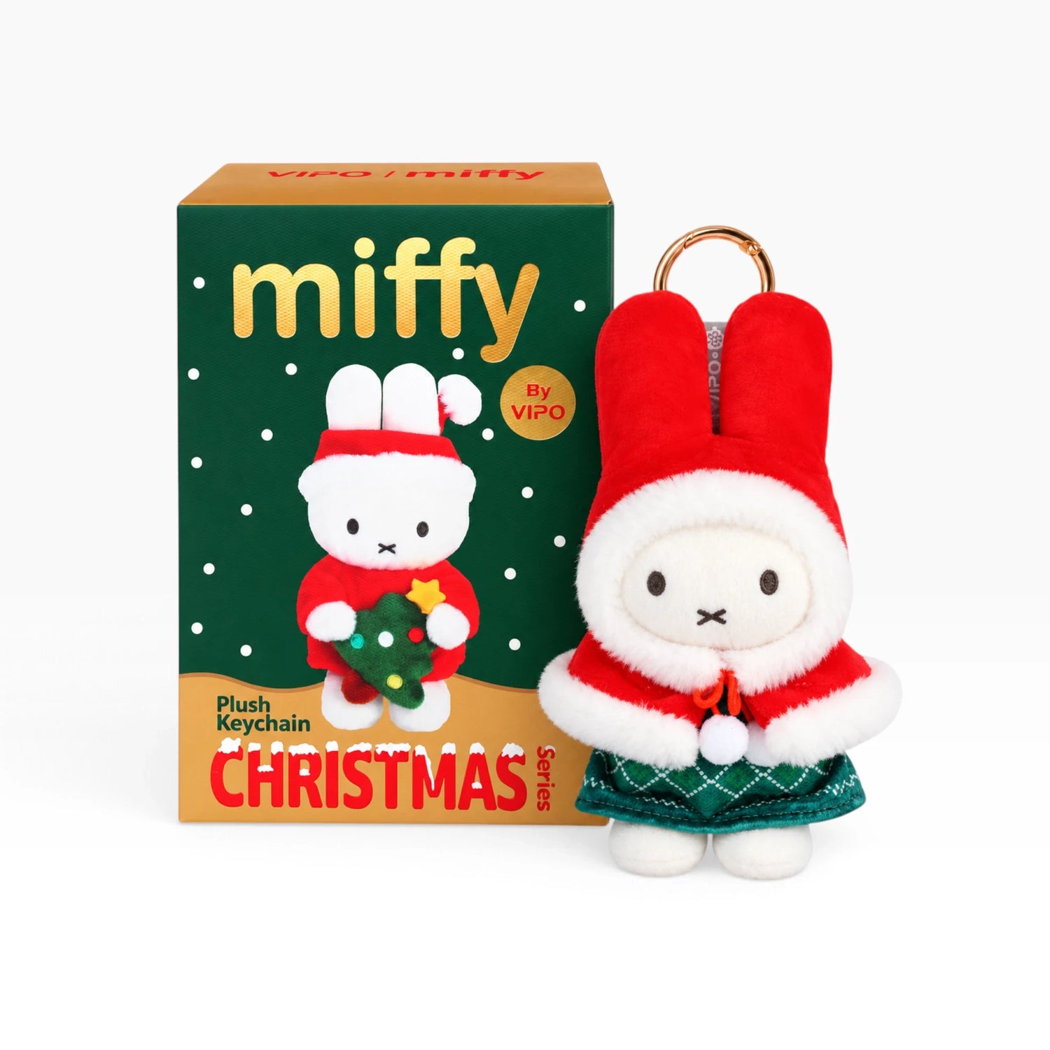 White rabbit Christmas plush keychain in red hood with green skirt and star detail