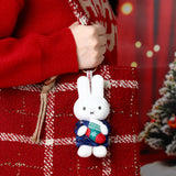 White rabbit Christmas plush keychain in blue patterned sweater with hanging metal ring