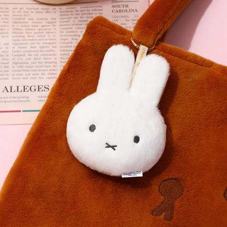 White plush bunny pouch keychain with brown outer body and hanging key ring