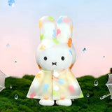 White bunny raincoat plush keychain with pastel hood and dot accents