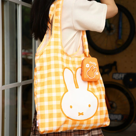 Yellow check tote bag with large bunny face and small miffy pouch keychain