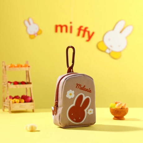 Gray Melanie miffy bunny mini keychain pouch with flower logo and zipper