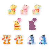 Assorted mini figurines: Pooh, Piglet, and Tigger poses, plus two other characters