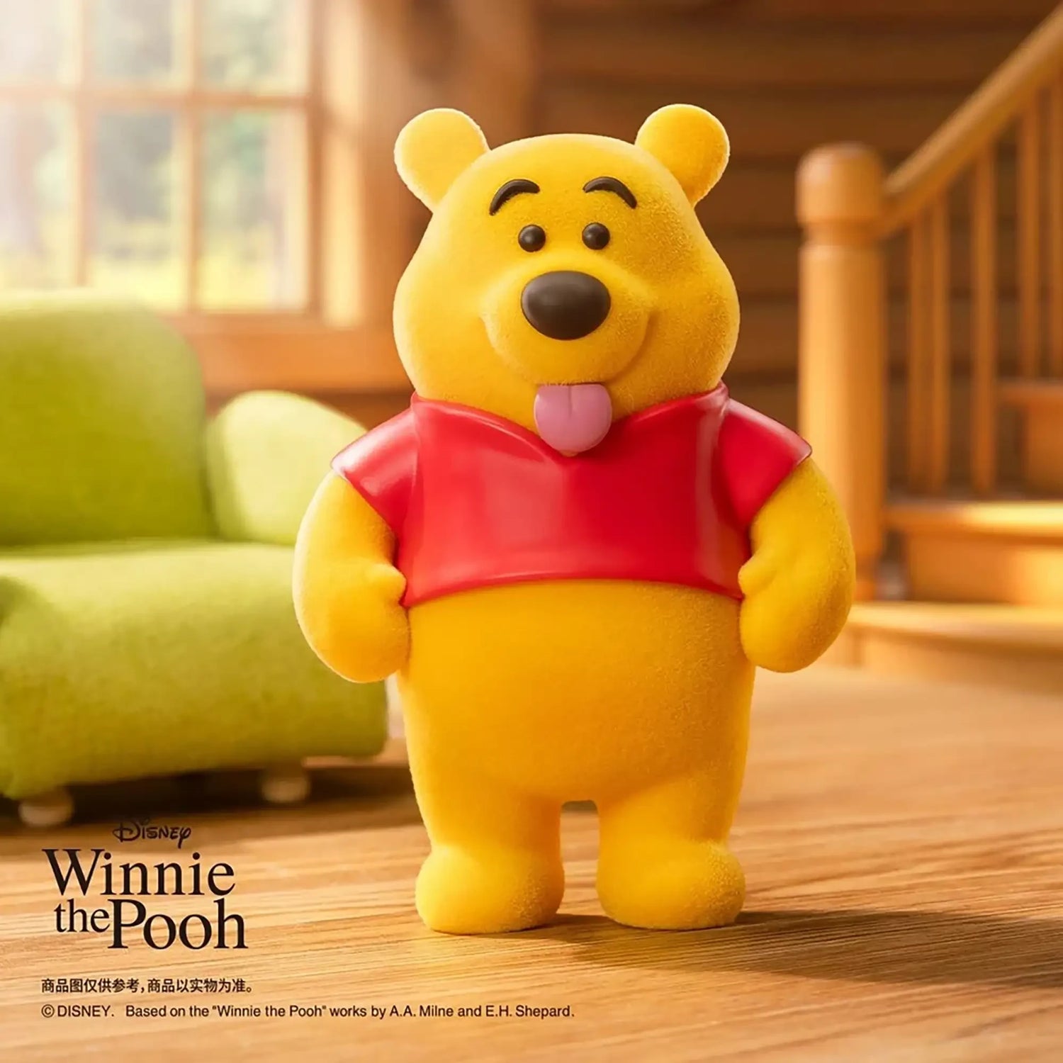 Yellow bear figure in a red shirt, smiling with one arm raised