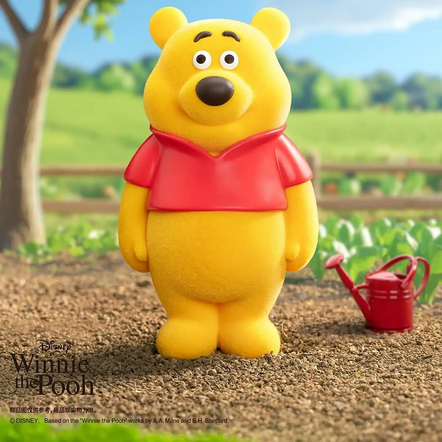 Yellow bear figure in a red shirt standing with arms down, neutral expression