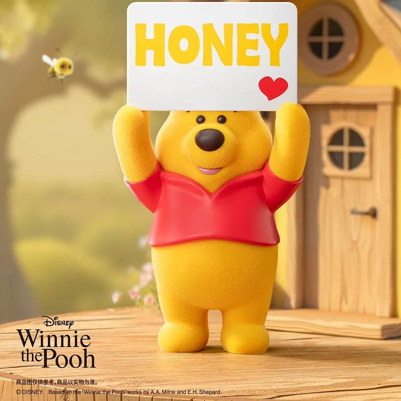 Yellow bear figure holding a “HONEY” sign with a red heart