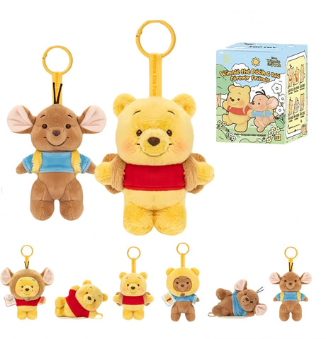 Two plush keychain characters, a yellow bear wearing a red shirt and a brown mouse with blue overalls, with packaging box displayed
