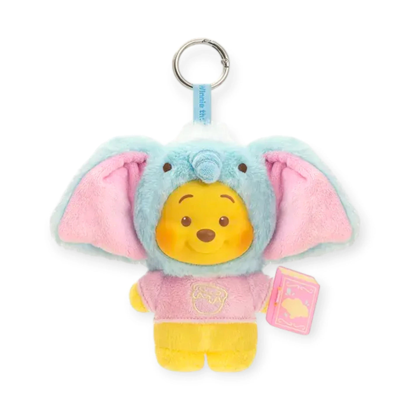 Blue and pink elephant-eared plush keychain with Pooh face, pink outfit, and pink book tag.