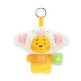 White and pink bunny-eared plush keychain with Pooh face, tan outfit, and green book tag.