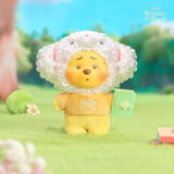 White lamb-eared plush keychain with Pooh face, yellow outfit, and green book tag.