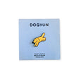 Orange cartoon dog thumb-up enamel pin on a light blue display card