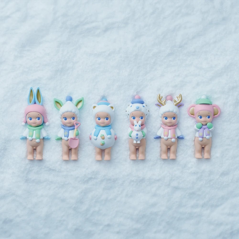 Sonny Angel Winter Wonderland mini figures lined up on light surface